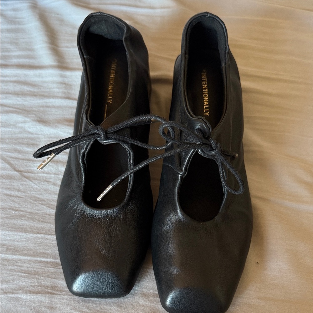 INTENTIONALLY BLANK Black Heels